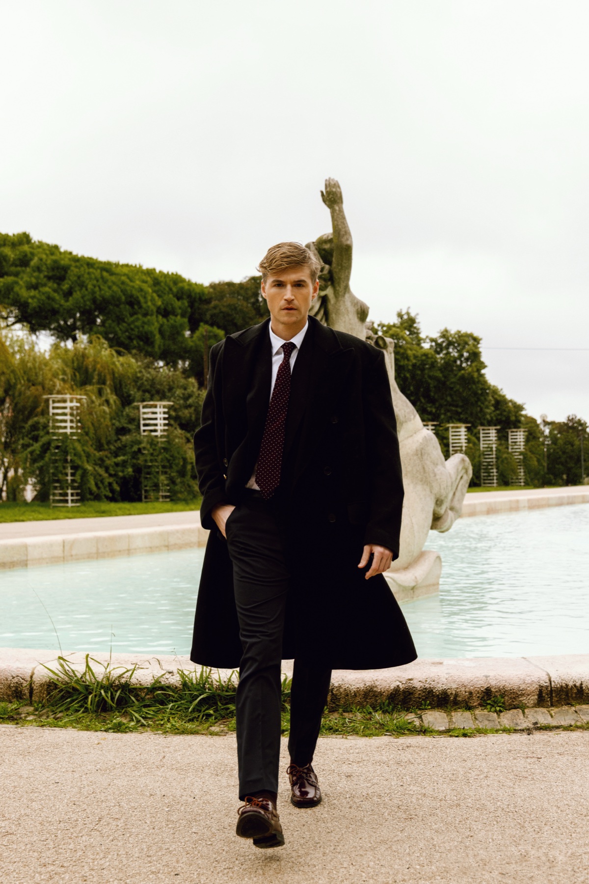 Chad J. Payne editorial — Lisbon 2025, long overcoat by sculpture, photographer David Velez